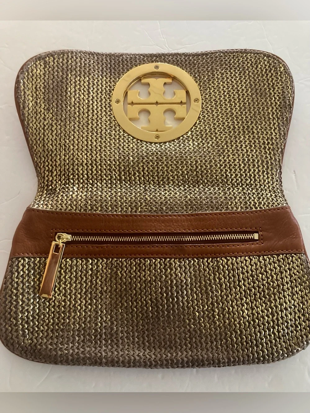 Tory Burch Brown/Gold Woven metallic body,fold over Clutch with big Gold Emblem